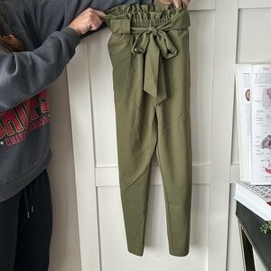 Green dress pants with tie bow in the middle waist